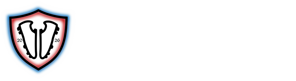 Black shield glowing blue on the outside and red on the inside. Inside the shied are two soccer cleats facing each other, and the number 2026. To the right of the logo are the words "Shoe Shields"